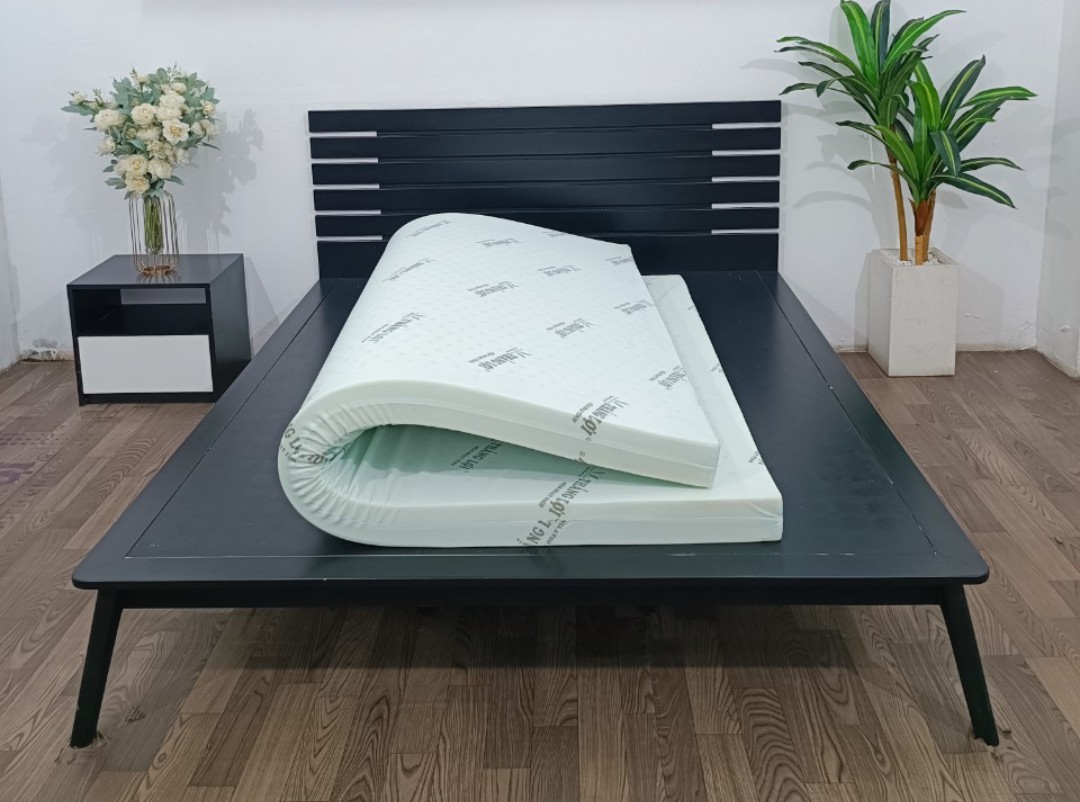A mattress on a bedDescription automatically generated